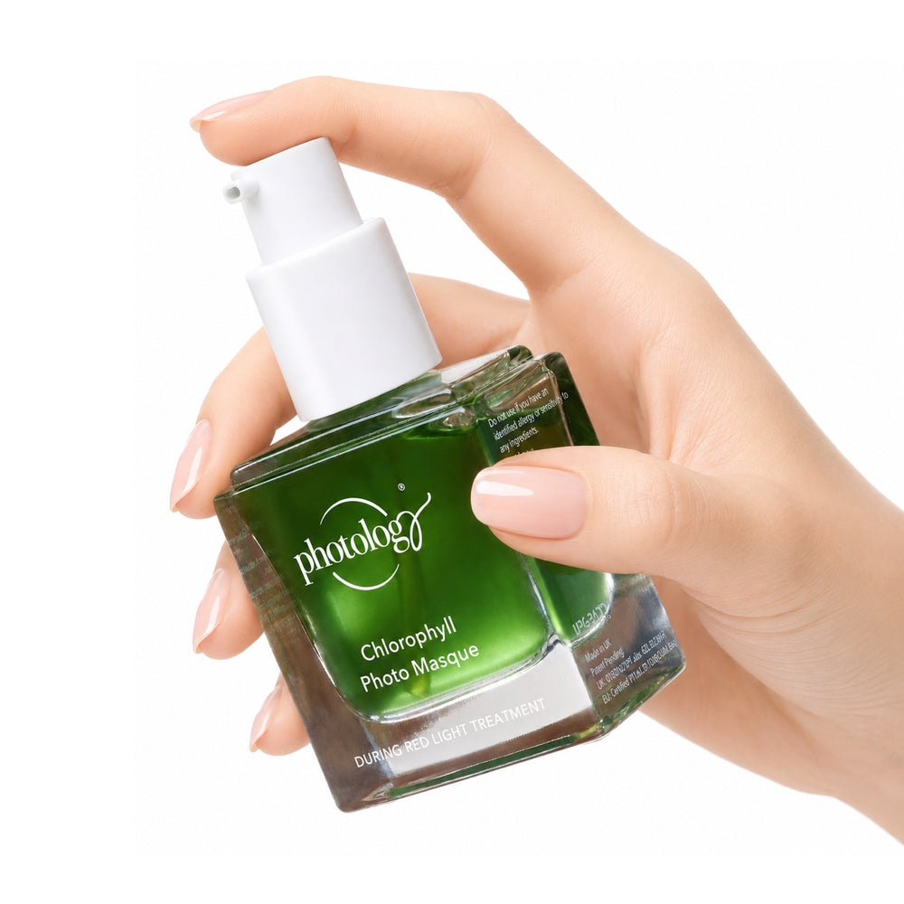 A hand with manicured nails holds a square green glass bottle labeled Rio Photology Chlorophyll Light Serum Masque with a white pump, ideal for use alongside your LED Face Mask or red light therapy routine.