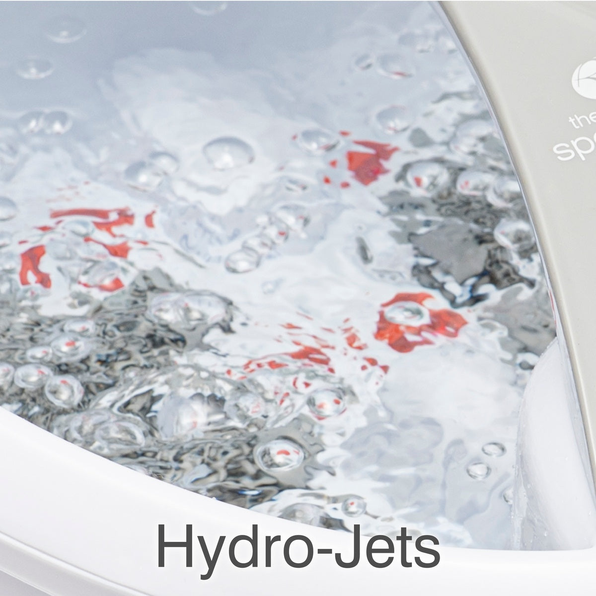 Close-up of bubbling water inside a Rio Deluxe Foot Spa Bath and Massager, with "Hydro-Jets" at the bottom, highlighting the powerful water jets in action.