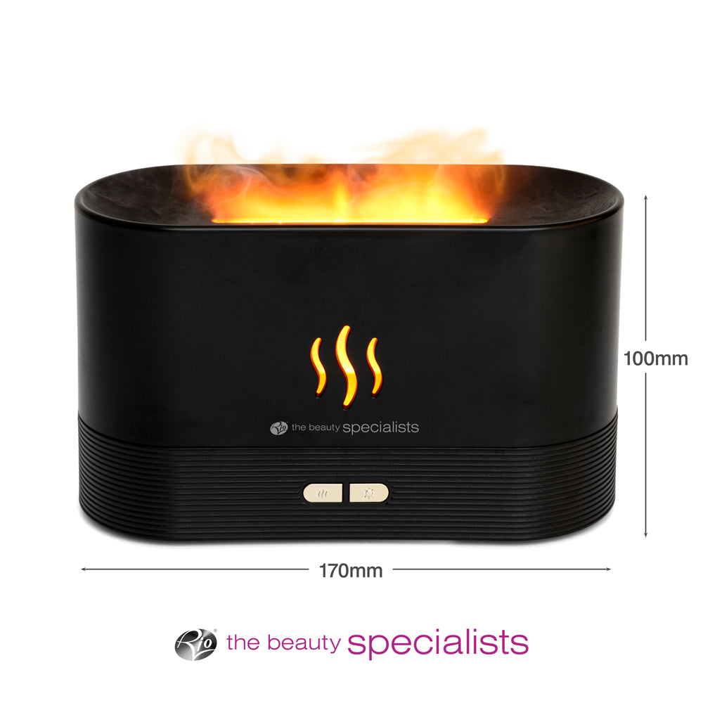 The ALTA Aroma Diffuser, Humidifier and Night-light by Rio is a black, oval device (170mm x 100mm) with a flame effect top, three wavy orange lines, control buttons, and the beauty specialists logo—ideal for use with essential oils.