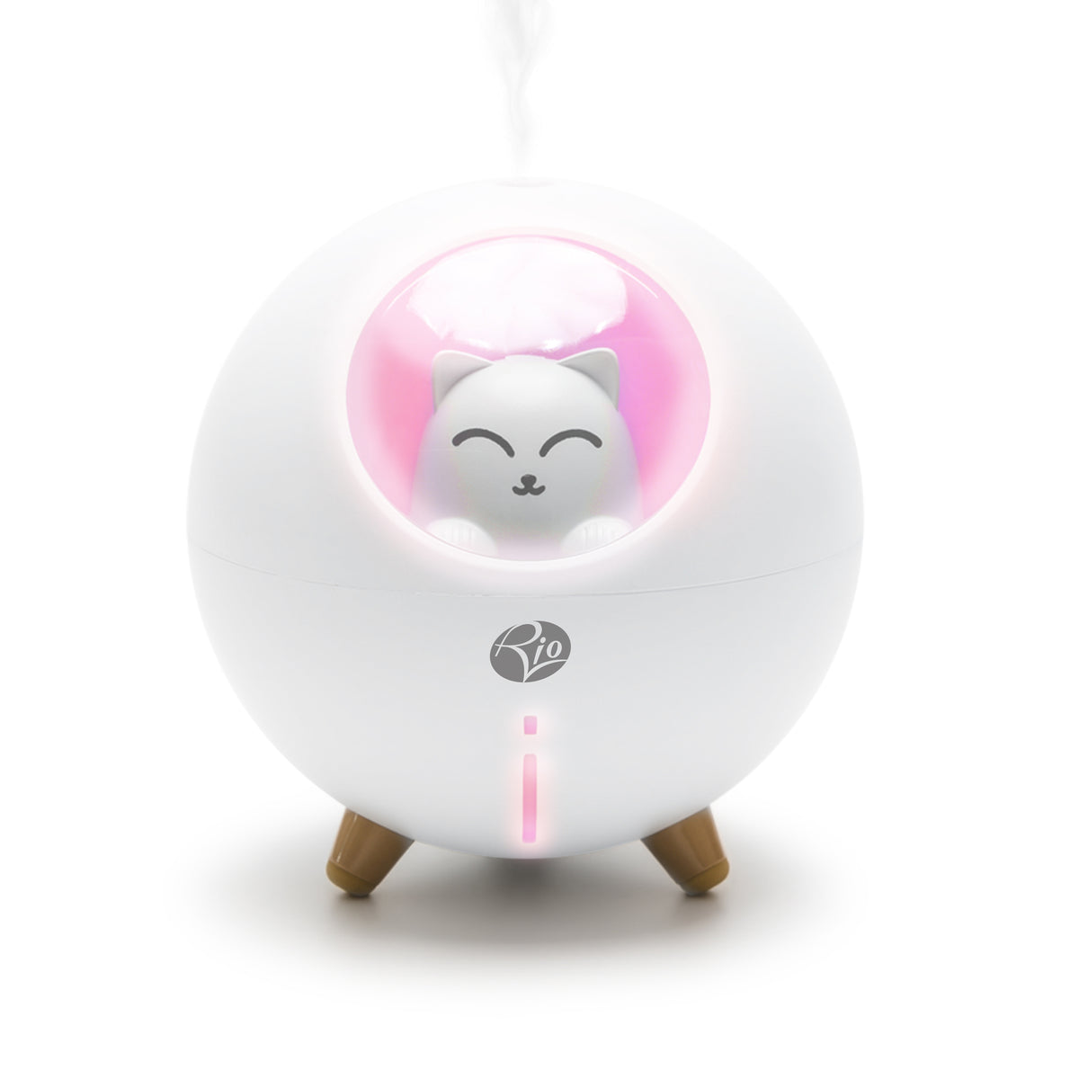 A round, white Rio humidifier stands on three brown legs, featuring a small, smiling cat in a pink-lit window. It emits a thin mist and can use AROMATHERAPY DIFFUSER REPLACEMENT FILTERS for enhanced freshness.