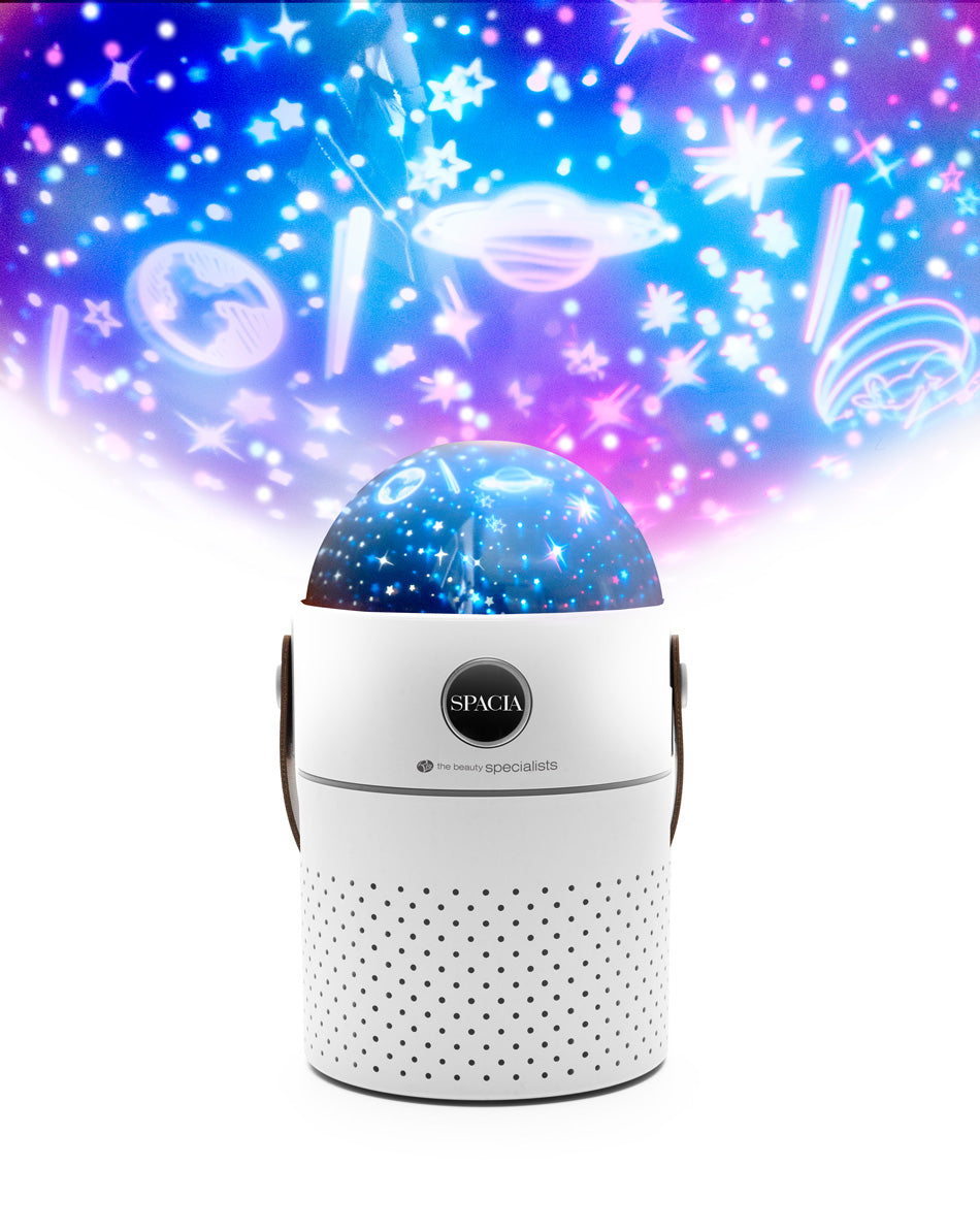 The Rio Galaxy Projector Childrens Essential Oil Diffuser, Humidifier, and Night Light projects vibrant stars, planets, and cosmic shapes to create a colorful space-themed display while also humidifying and scenting the room.