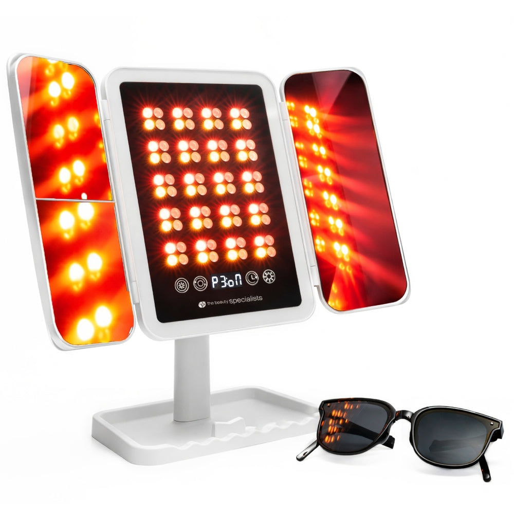 The Rio Radiance Light Therapy Panel, featuring three illuminated panels on a stand, emits bright red LED light for advanced skincare. A pair of black sunglasses rests in front of the device on a white surface.