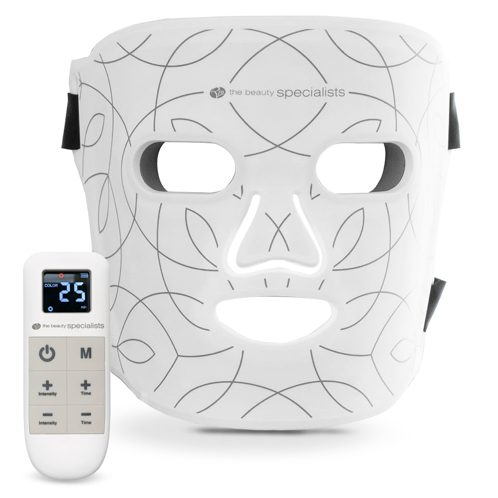 The Rio LED Face Mask by Rio features light therapy, abstract line patterns, and cutouts for eyes, nose, and mouth. It comes with a handheld remote control to adjust intensity and anti-ageing color settings.