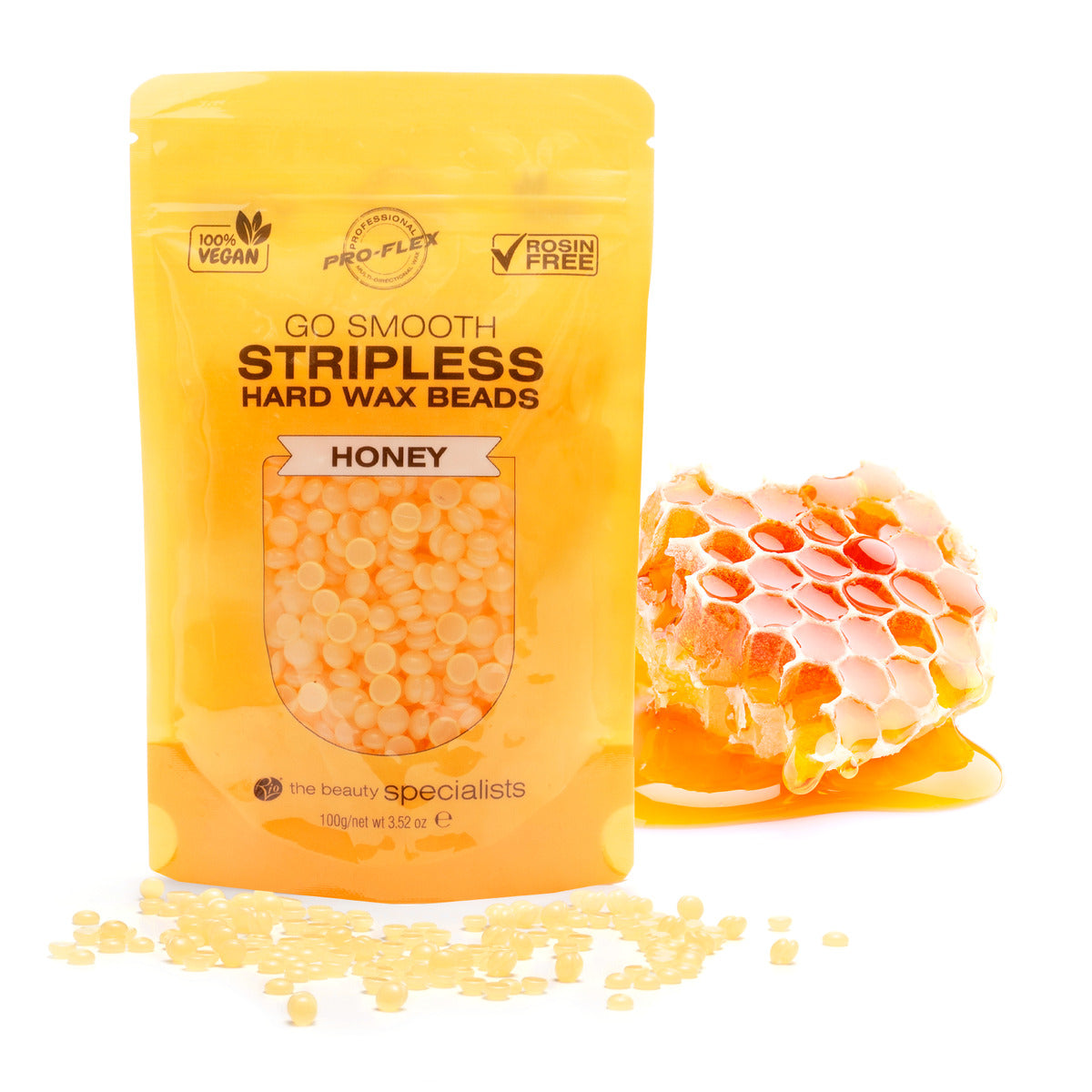 1 pouch of 100g honey scented GO SMOOTH STRIPLESS hard wax beads with a small section of honeycomb in the background