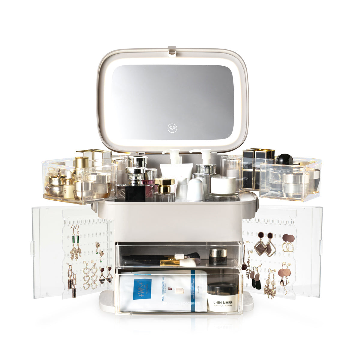 The Rio Ultimate Beauty Storage Box With Dimmable Mirror features drawers for jewelry, compartments for accessories, side doors that display earrings, and spacious sections for perfume and skincare bottles, all in a stylish acrylic design.