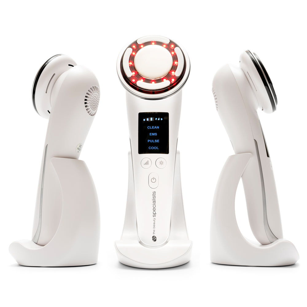 The Rio FaceLift & Tone Beauty Spa is a white handheld anti-aging device with a digital display and red LED lights, shown from three angles on a white stand. It’s designed to help achieve firmer-looking skin.