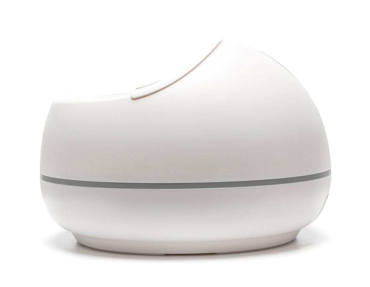 The Rio Steam Foot Spa is a modern, sleek, white, dome-shaped device with a smooth surface and thin gray line—perfect for soothing aching feet with relaxing steam technology.