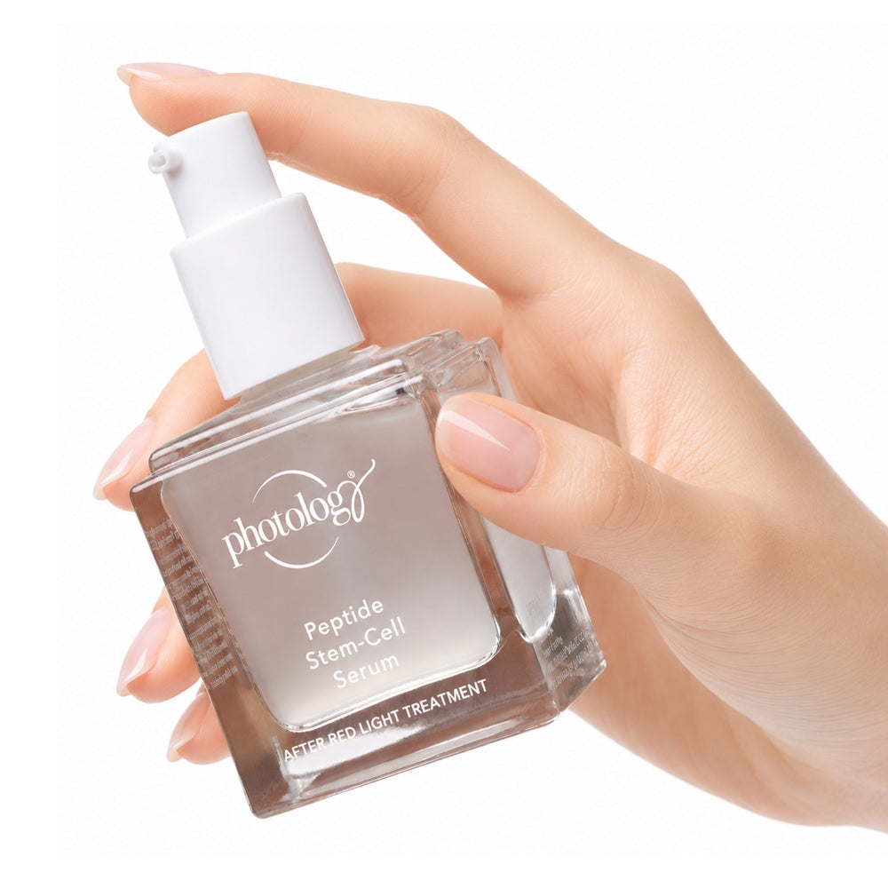 A hand with neatly manicured nails holds a bottle of Rio Photology Peptide Stem-Cell Serum featuring a white pump dispenser, set against a white background.
