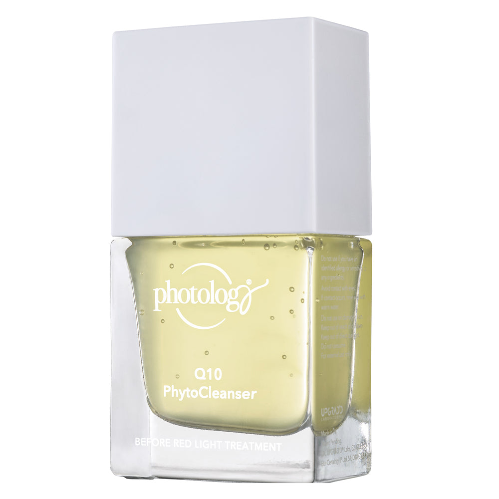 A clear square bottle of Rio Photology Q10 Pre-treatment Phyto Cleanser with a white cap contains yellow gel for use before red light therapy to support collagen repair.