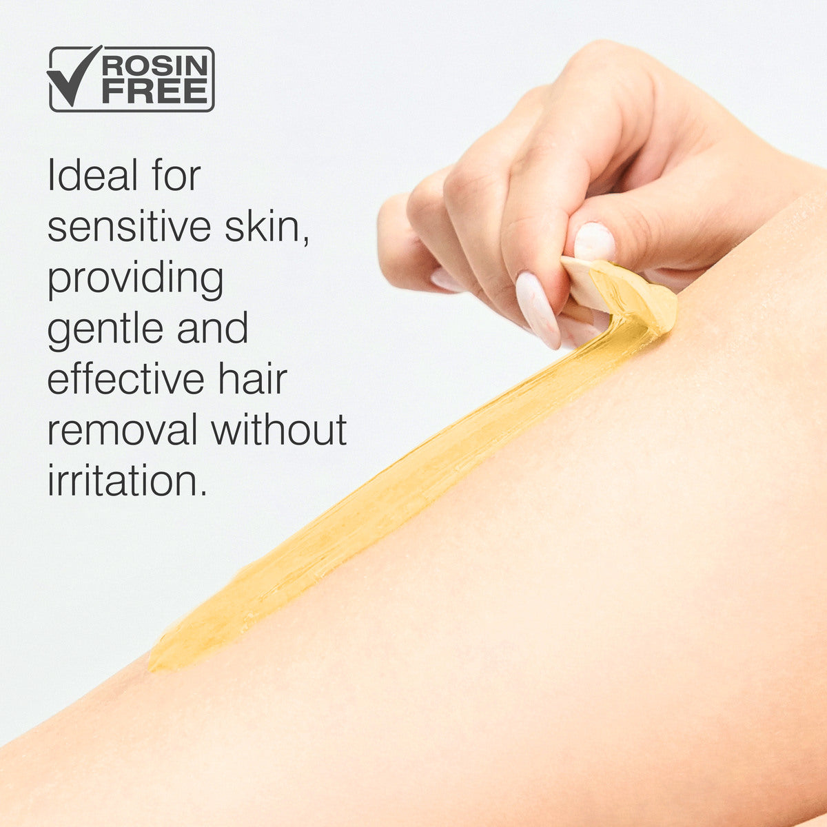A hand peels off wax from a leg. Text: Rio Honey Go Smooth Stripless Hard Wax Beads (100g). Rosin free and ideal for sensitive skin, this gentle wax offers smooth, effective hair removal without irritation.