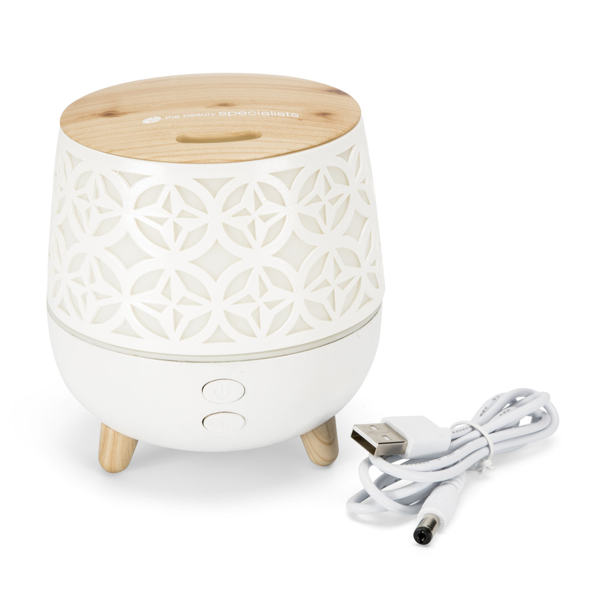 The Rio TALIA Aroma Diffuser, Humidifier & Night-Light features a white and wood design with a cut-out pattern, two front buttons, three short legs, and comes with a white USB power cable.