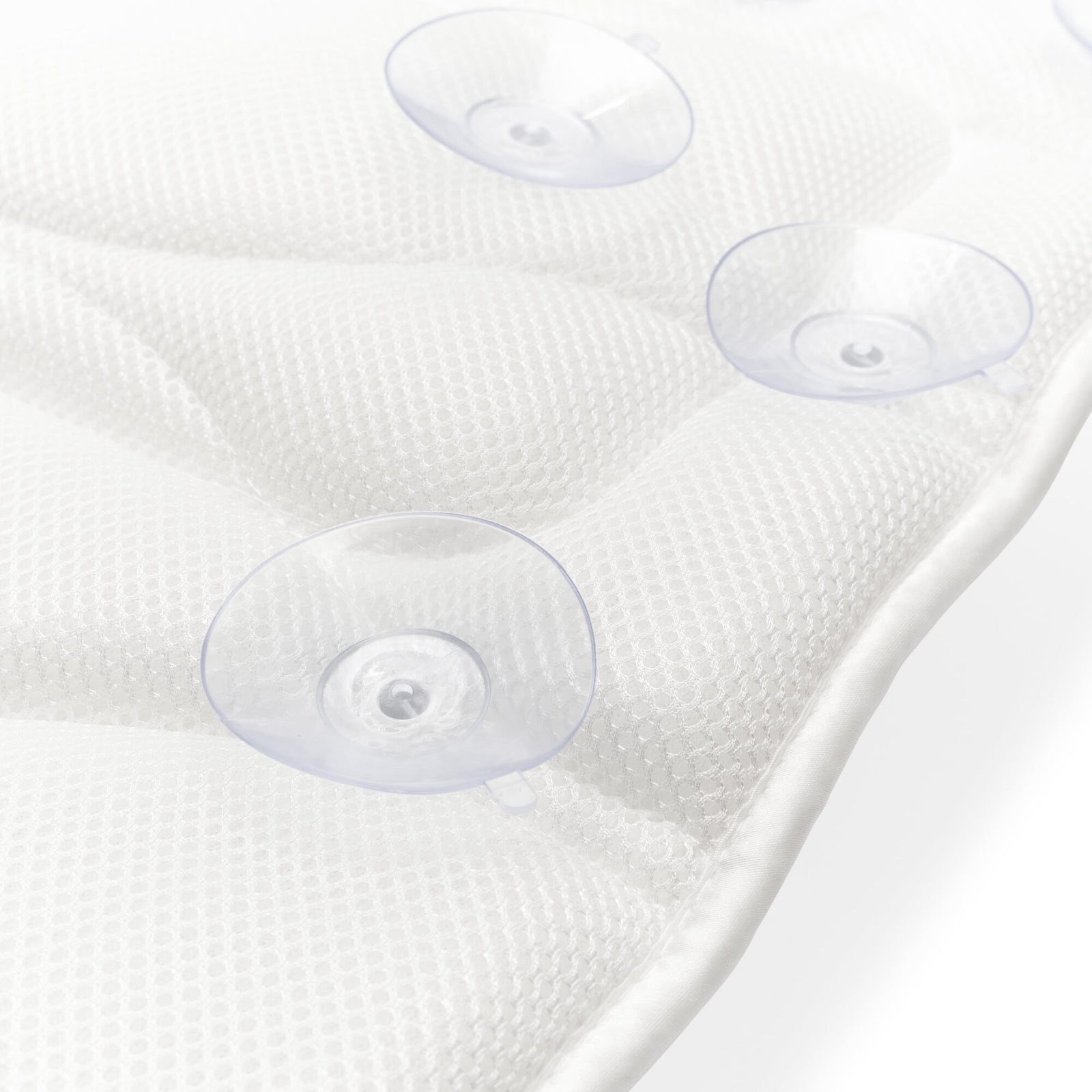 Close-up of the Rio Luxury Bath Mat & Pillow in white, featuring three clear suction cups for secure grip, shown on a white surface.