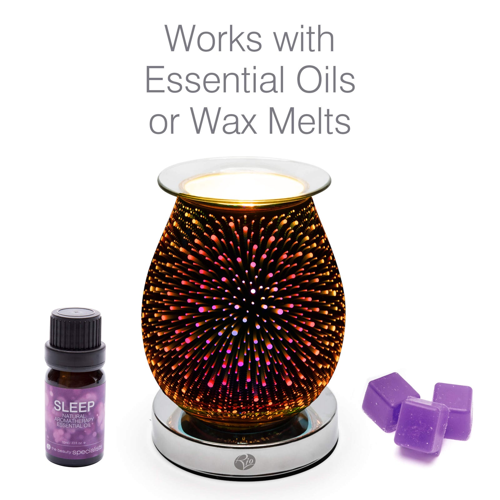 The Rio Alura Wax Melt Burner & Aroma Diffuser Lamp features a colorful firework pattern and glows beside a bottle of Sleep essential oil and three purple wax melts. Works with essential oils or wax melts—perfect for any space.