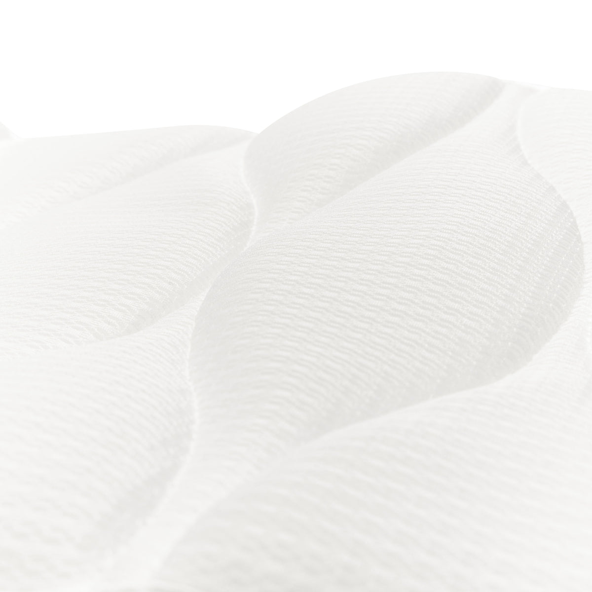 Close-up of the Rio Luxury Bath Mat & Pillow shows a white, textured surface with raised wavy patterns and soft quilted detail, highlighting the plush comfort and gentle contours of this premium product.