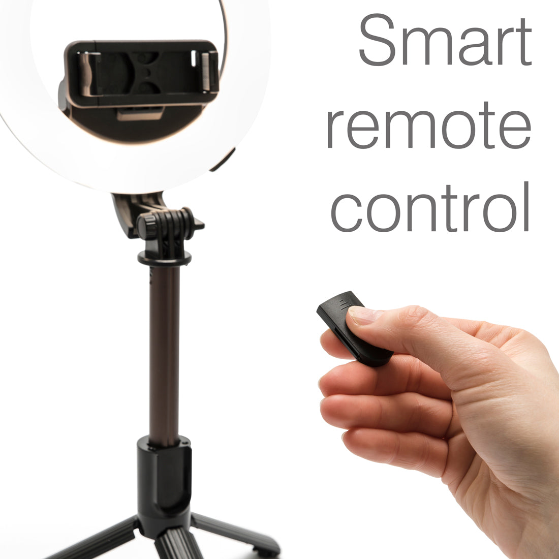 A hand holds a smart remote in front of the Rio GlamourGlow Pro Beauty & Vlogging Ring Light on its tripod with smartphone holder—perfect for flawless makeup. Large text on the right reads, Smart remote control.