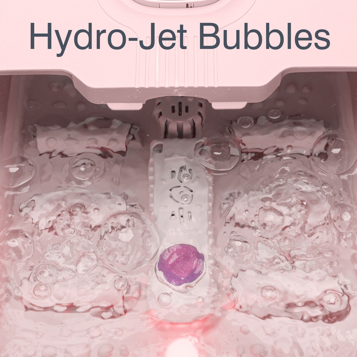 Close-up of hydro-jet bubble feature in pink foot spa designed for foot massage and relaxation.
