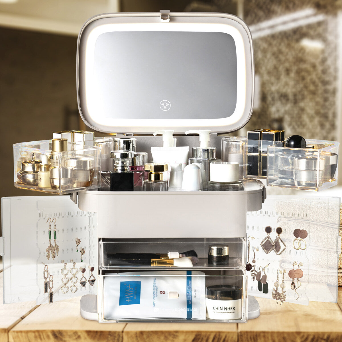 The Rio Ultimate Beauty Storage Box With Dimmable Mirror neatly holds your perfume, skincare, and jewelry—like earrings and rings—on shelves and in compartments, making it the perfect portable vanity for daily essentials.