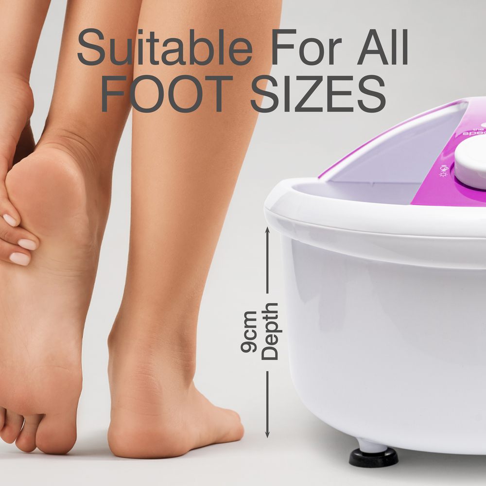 A person touches their bare foot near a Rio Deluxe Foot Spa Bath and Massager - Purple. Text above reads Suitable For All FOOT SIZES with a label showing 9cm depth.