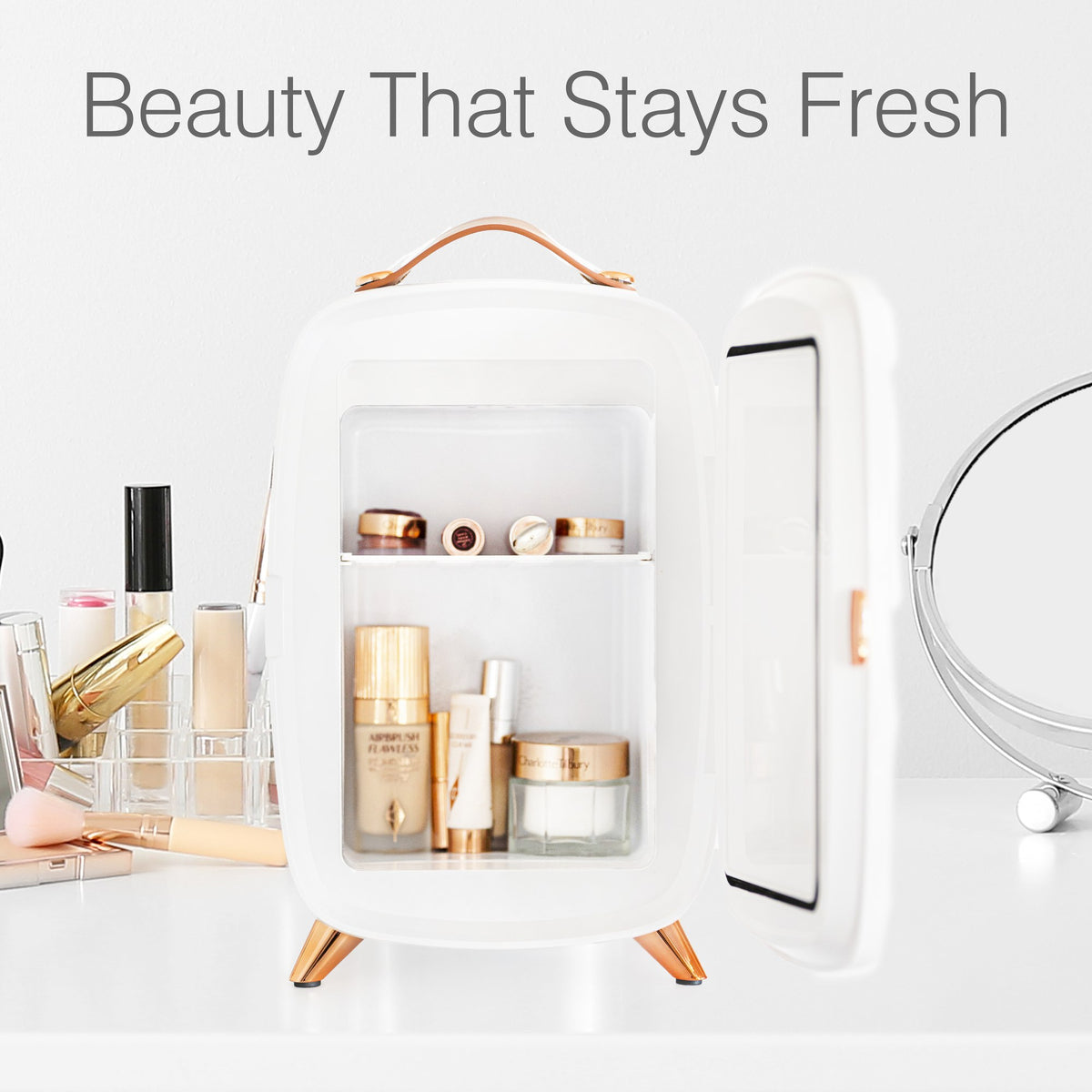 A Rio Beauty Skincare Fridge With Mirror sits open on a white vanity beside makeup brushes and cosmetics, keeping creams fresh. The text above reads: Beauty That Stays Fresh with chilled storage.
