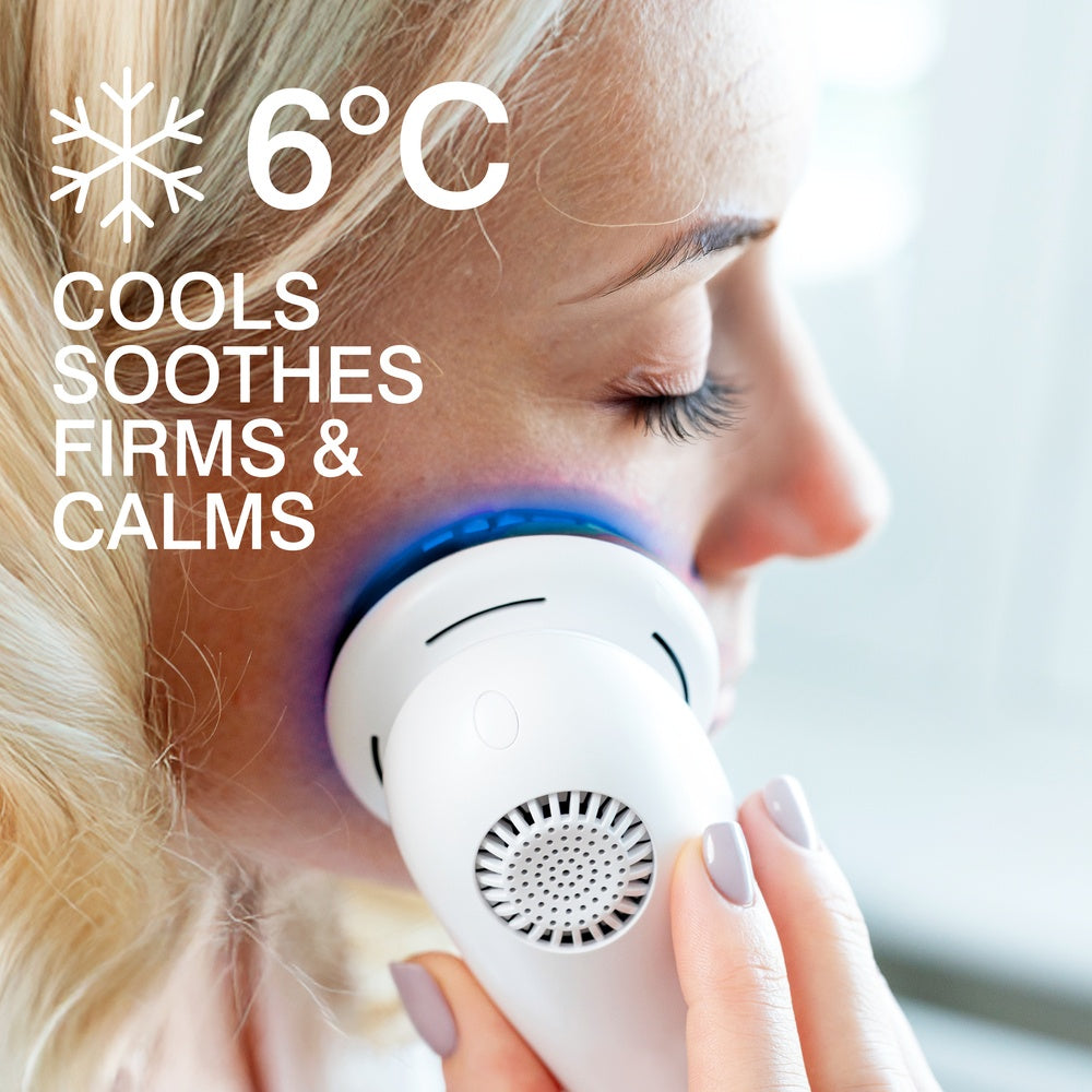 A woman uses the Rio FaceLift & Tone Beauty Spa device with blue light on her cheek. Text reads: 6°C Cools, Soothes, Firms & Calms—highlighting cooling skincare benefits for firmer-looking skin.