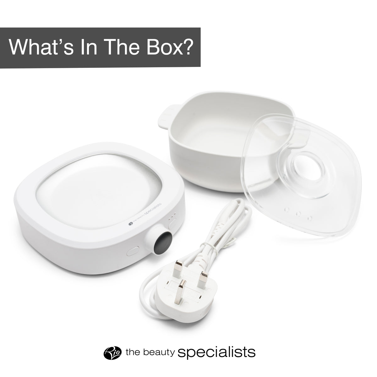 A white electric facial steamer with power cord, removable water tank, and clear lid—ideal for use with your Rio Go Smooth Hair Removal Wax Heater or wax melts. Text above says Whats In The Box? with the beauty specialists logo below.