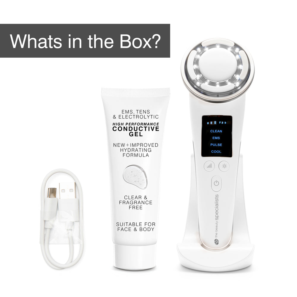 The Rio FaceLift & Tone Beauty Spa includes a white handheld anti-aging device with digital display, a tube of conductive gel, and a USB charging cable—perfect for firmer-looking skin. "What's in the Box?" appears on a gray rectangle.