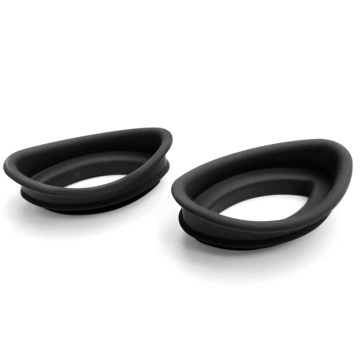 Two black, oval silicone FaceLite Eye Shields by Rio with raised edges are shown on a white background. These flexible accessories serve as seals or cushioning for the Rio FaceLite device.