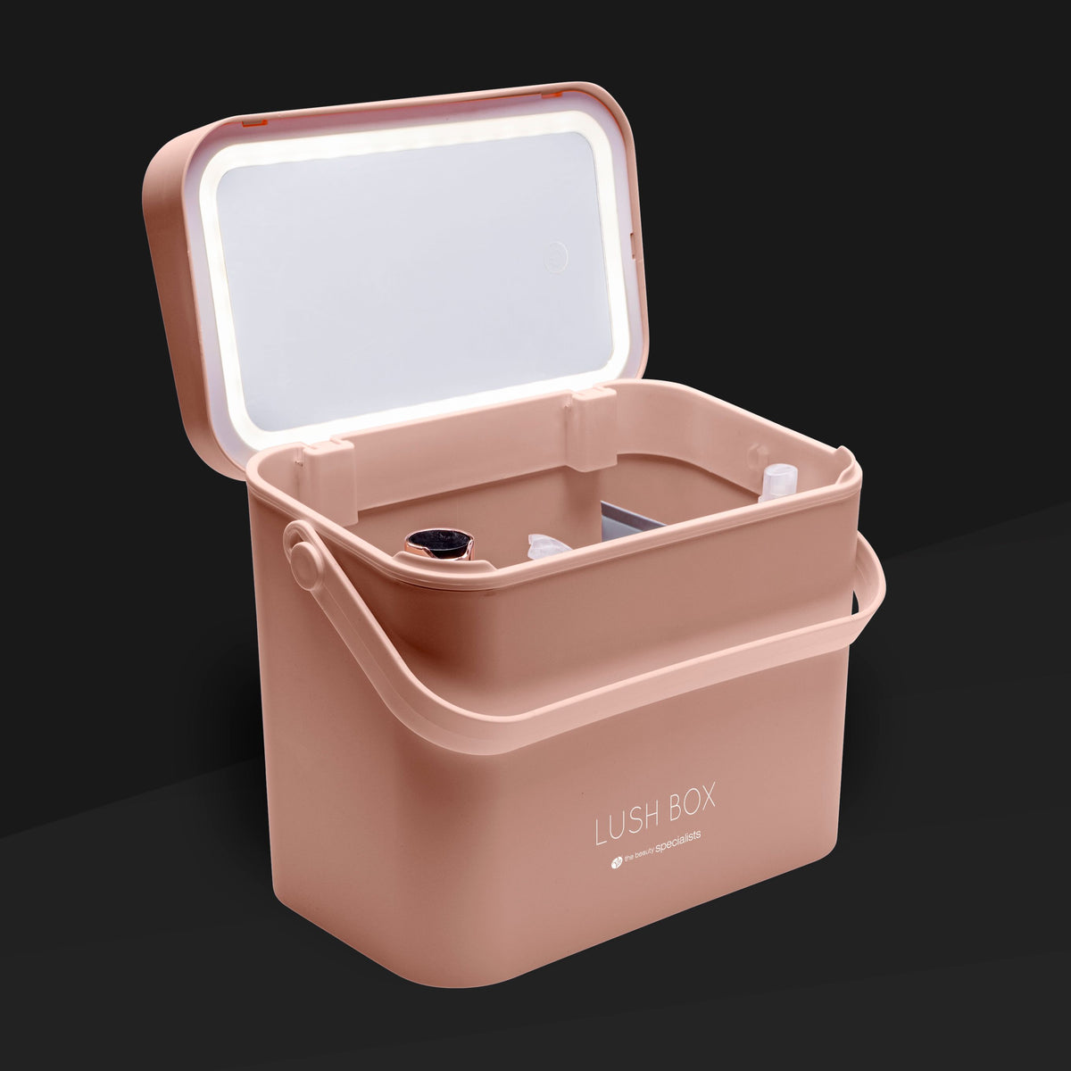 The Rio Lush Box Vanity Case - Large is a pink rectangular case with a handle and open lid, showing multiple small cosmetic bottles and containers inside—ideal for all your beauty storage needs, set against a dark background.