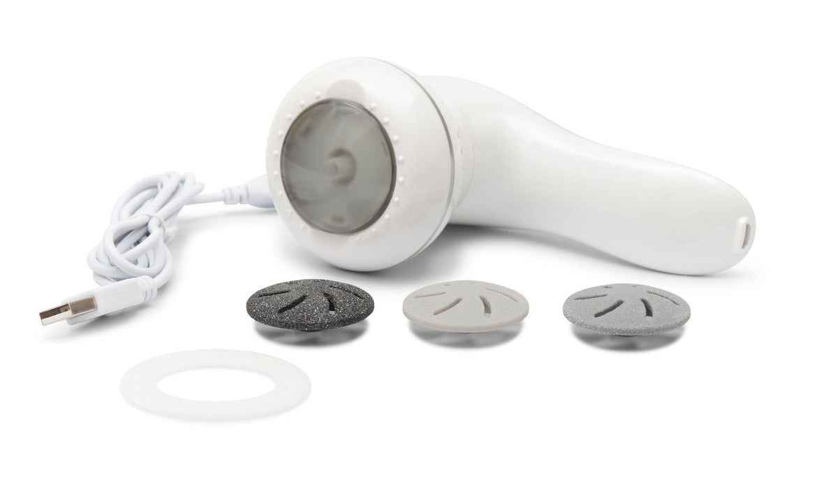 60 second spa pedi laid flat with sanding head rotating with 3 interchangeable sanding heads and USB charging cable