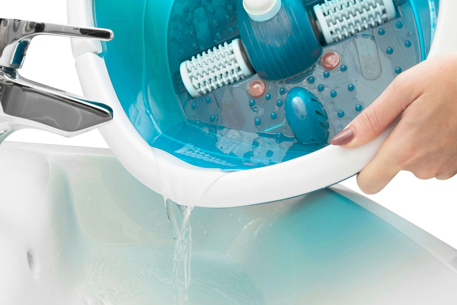 lady pouring water from footbath down sink 
