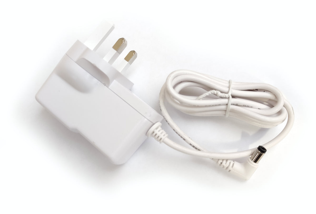 The Rio Adaptor for Aroma Diffuser, Humidifier &amp; Night-Light features a white three-prong UK plug with an attached coiled power cable, ideal for powering your devices.