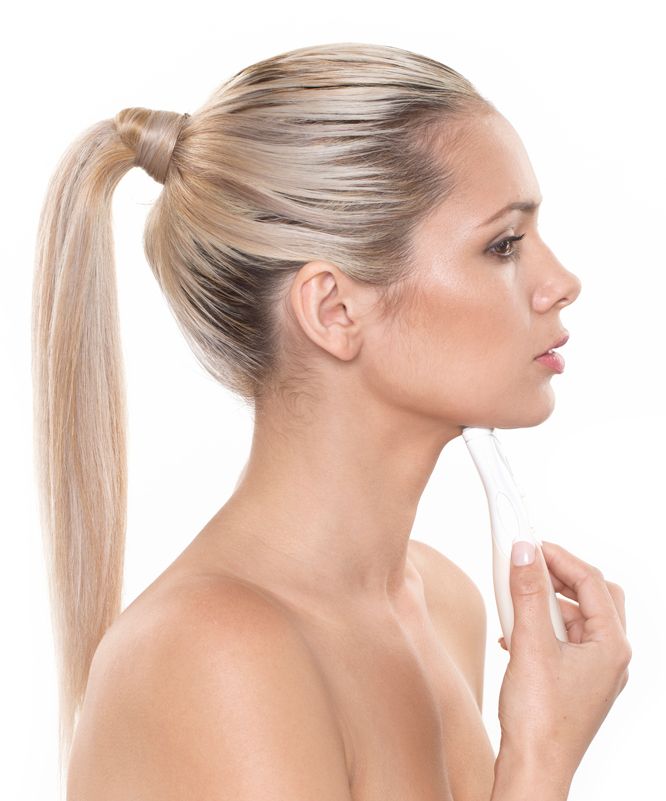 side view of blonde lady using Rio 60 second neck toner to treat chin area 