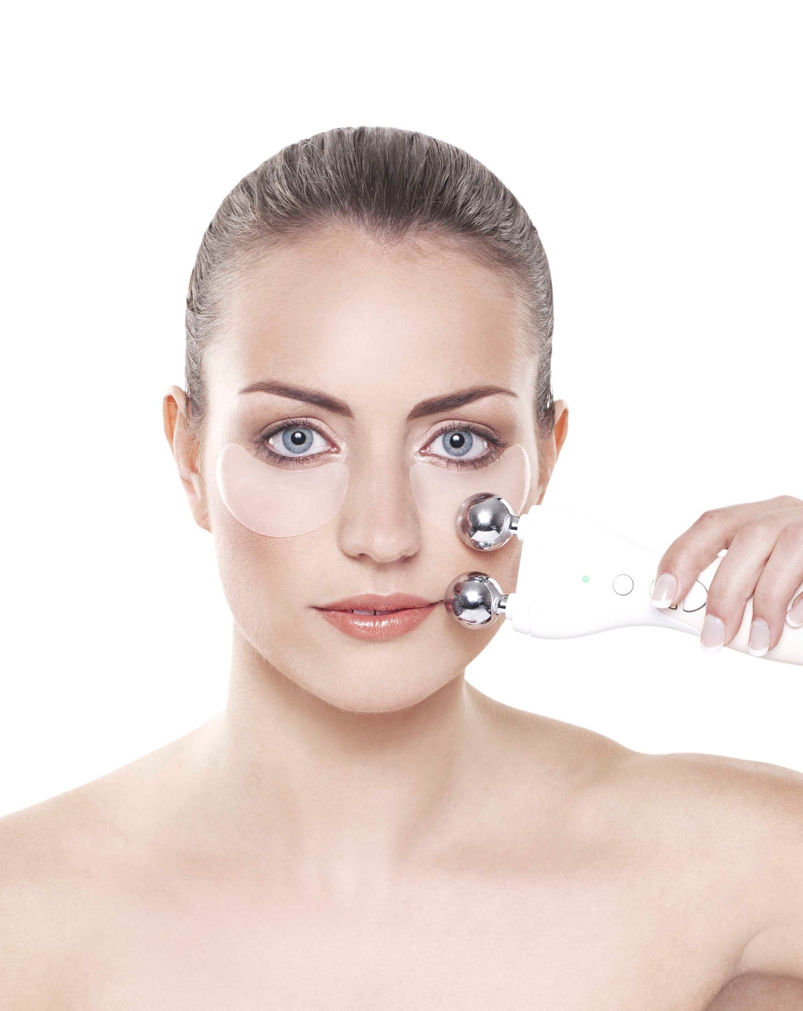 lady wearing under eye collagen and retinol patches and using Rio 60 second face lift on her cheek bone