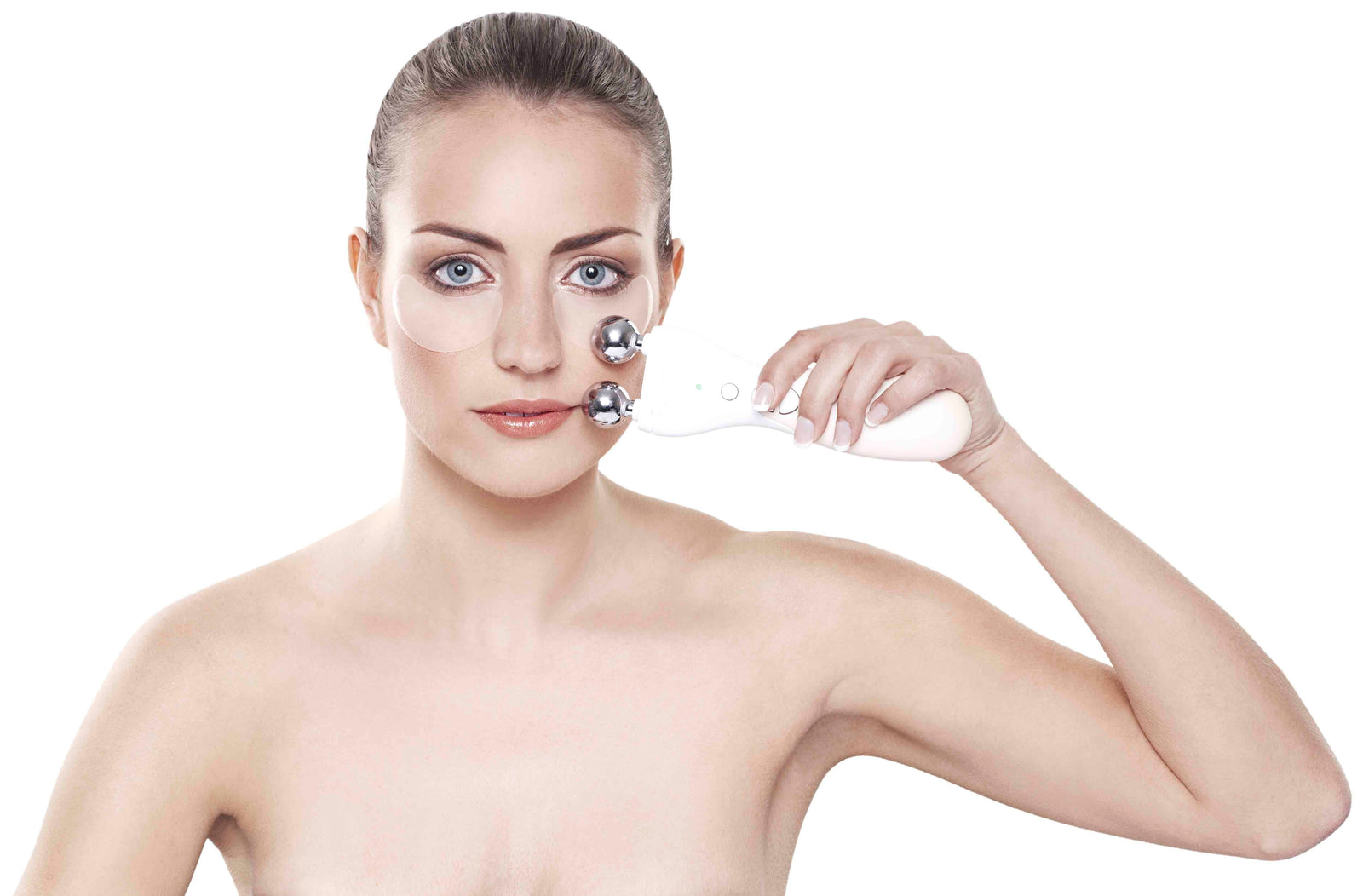 Brunette lady wearing collagen and retinol patches under her eyes using rio 60 second face lift pastel pink hand set to treat her cheek bone area 