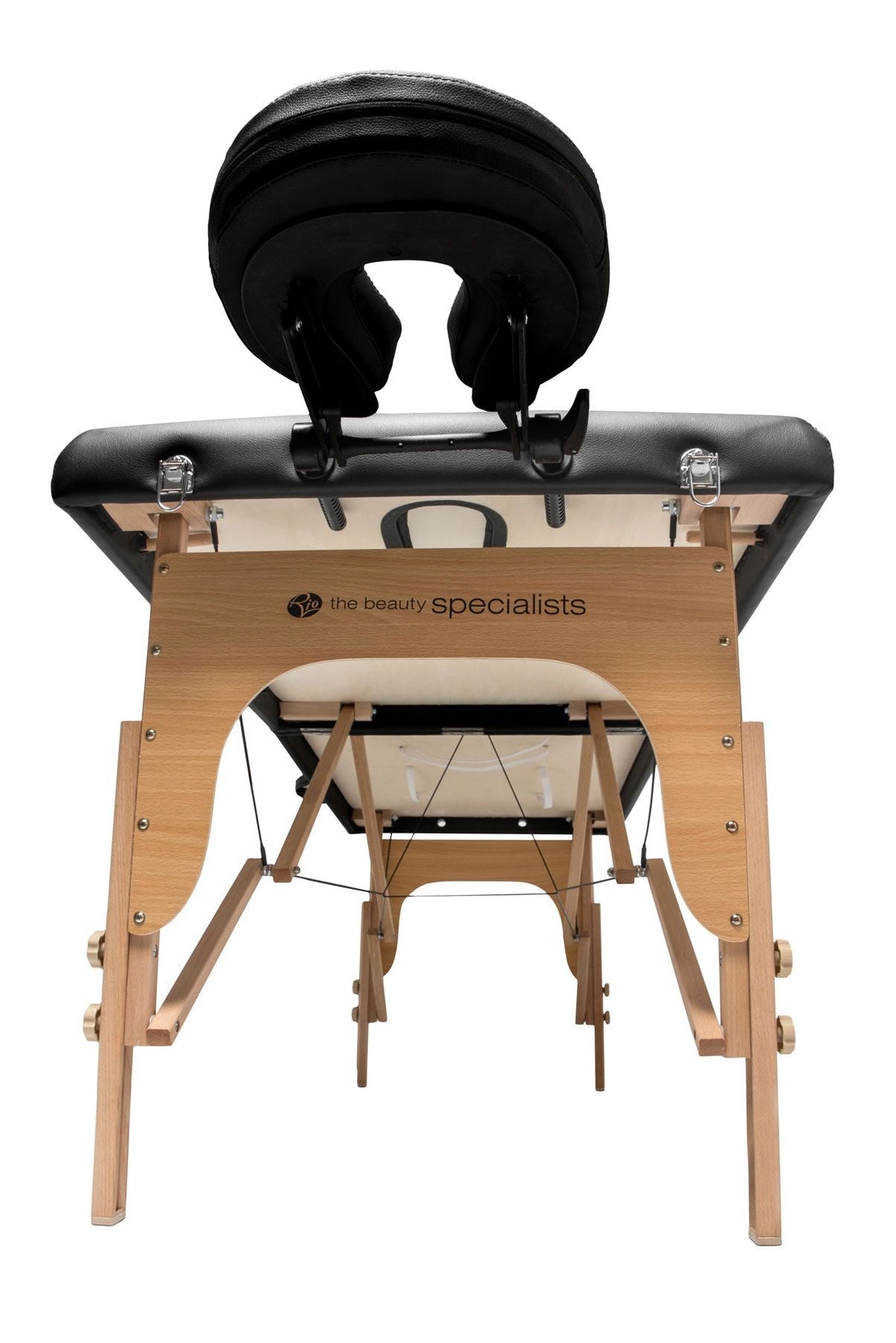 The Rio Professional Ultra-Light Portable Massage Table features a black cushioned face cradle and The Beauty Specialists logo on the side, with sturdy wooden legs and support beams, viewed from the foot end.