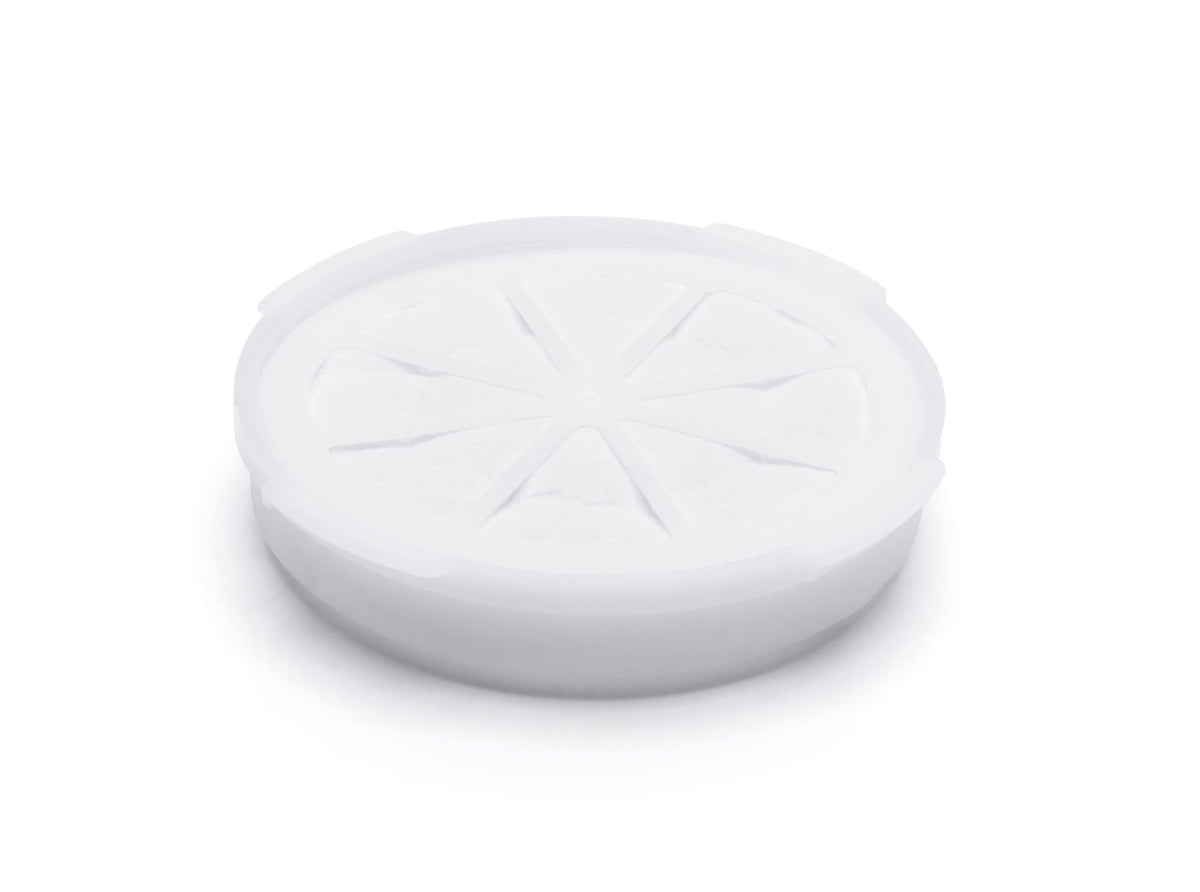 The Rio Aroma-Stream & Air Purifier Filter comes in a round, white plastic container with a citrus wedge embossed lid, designed to hold an Aromapad Filter. Shown on a plain white background.